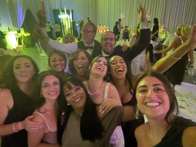 A picture of my family and in-laws, minus my mom and step dad, from my sister’s wedding last month.
