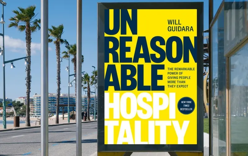 A billboard that says ’ unreasonable hospitality ’ on it