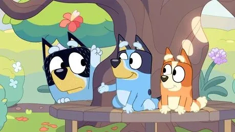Three cartoon dogs are sitting under a tree.